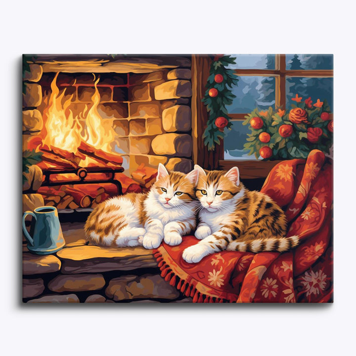 Katzen am gemütlichen Kamin